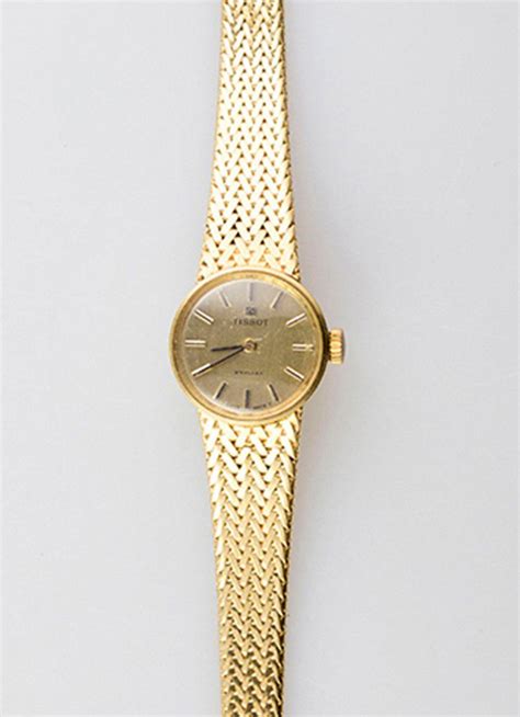 tissot 18ct gold ladies watch.